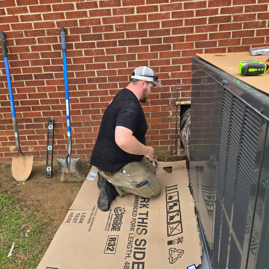 Dalton Fish of Dependable HVAC installing a new packaged HVAC system in Mount Gilead, NC. Professional HVAC replacement with expert ductwork connection.