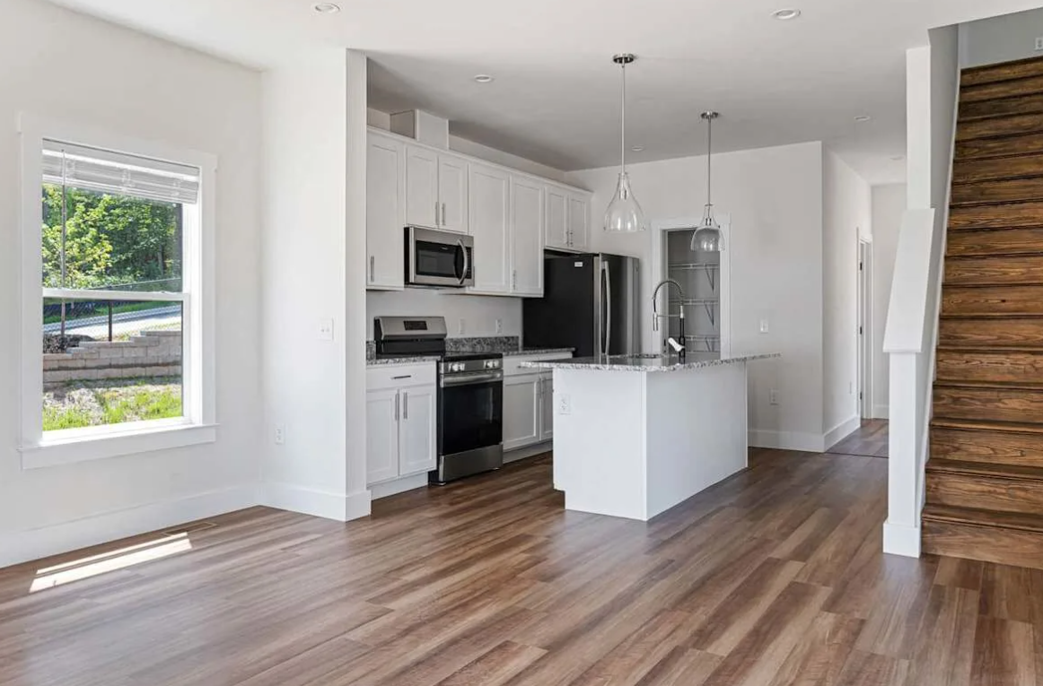 The kitchen at Belle Meadow Homes combines functionality with elegant, custom finishes.
