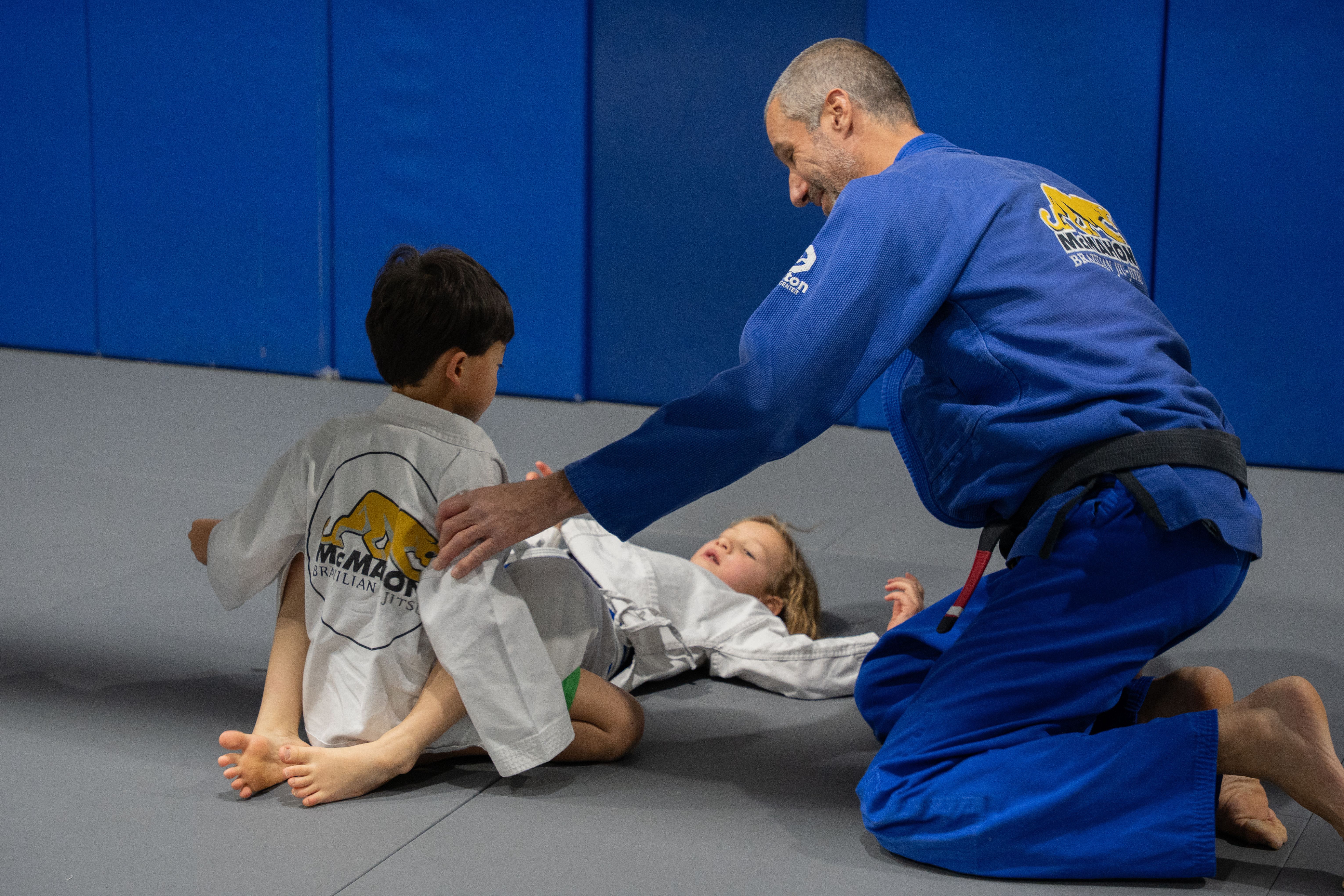 At McMahon Training Center, our Kids Brazilian Jiu Jitsu program is about more than learning techniques—it's about developing confidence, discipline, respect, and resilience.
Through structured training in a positive environment, students build valuable life skills while improving fitness, coordination, and self-defense abilities. Whether your child is new to martial arts or looking to grow their skills, our experienced instructors are here to help them succeed.
