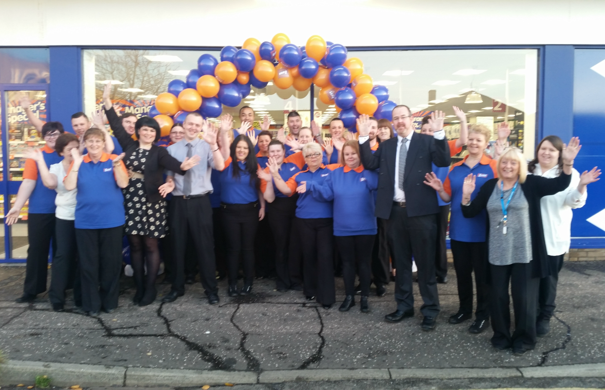 Store staff pose outside their new B&M Bargains Store in Grangemouth.