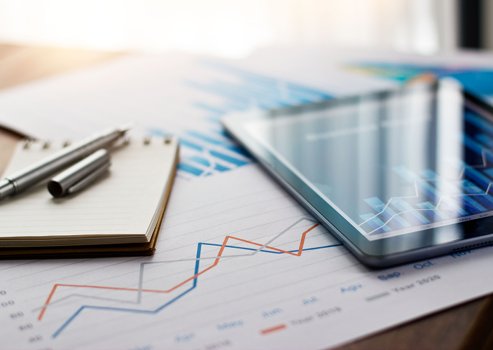 Close-up of financial graphs on a table.