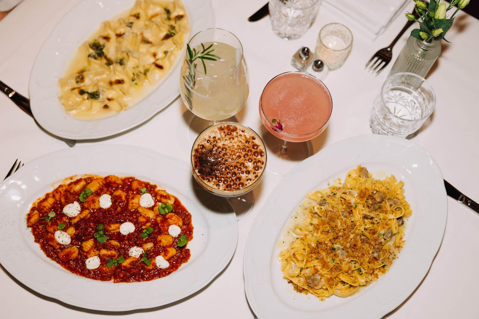 Array of pasta dishes and cocktails
