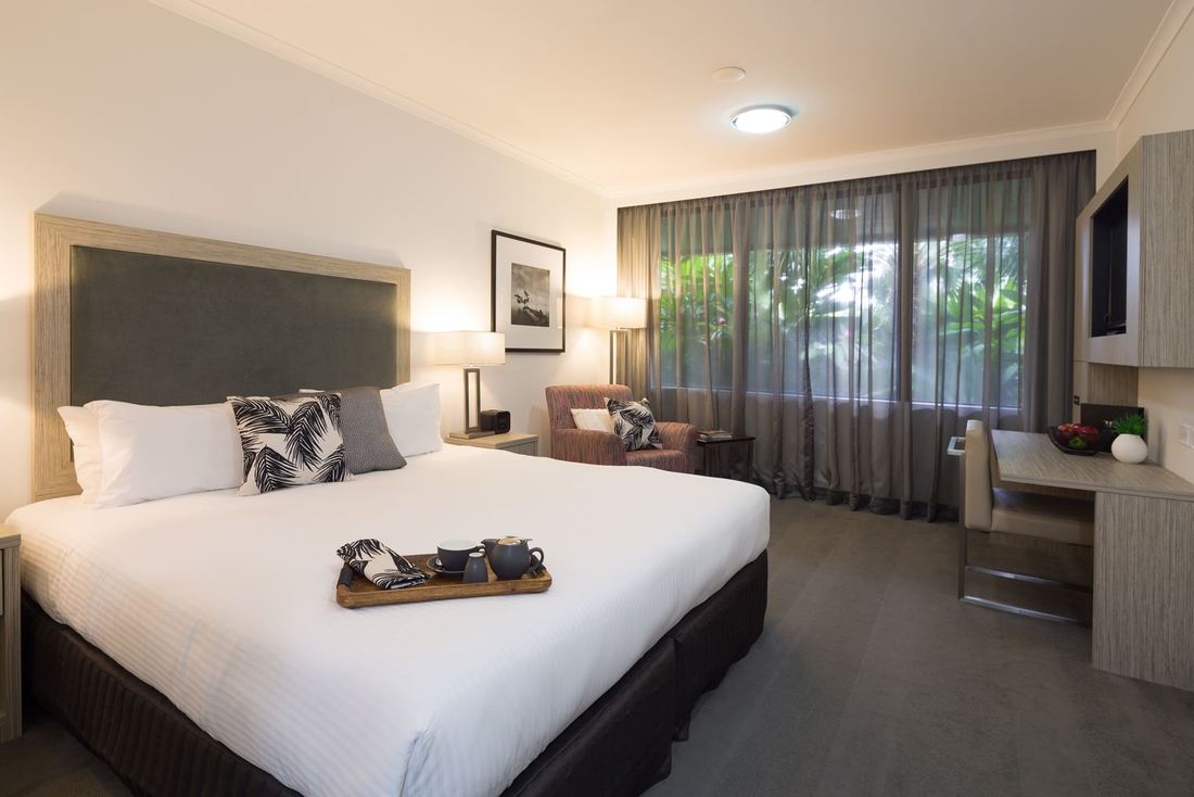 The H Queen offers a spacious retreat for up to two adults; it includes a queen size bed with a pill H on Smith Hotel Darwin (08) 8942 5555