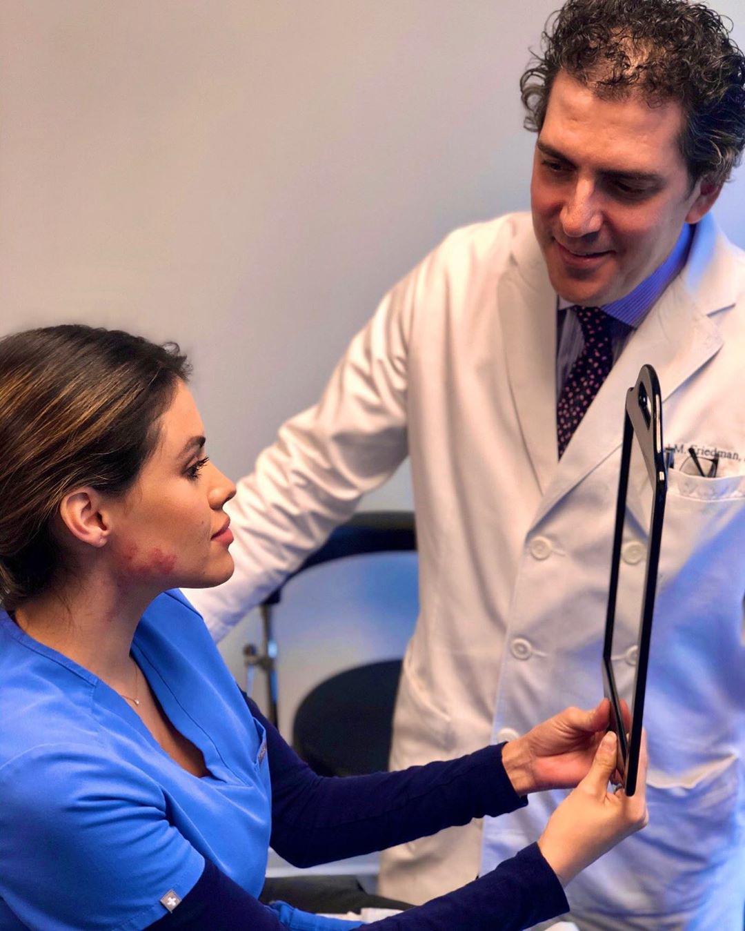 Dr. Friedman performs an initial consultation on a prospective patient.
