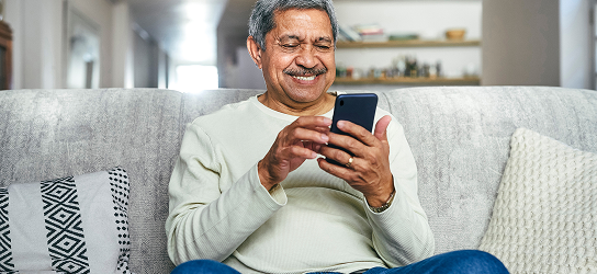 A man on his mobile phone.