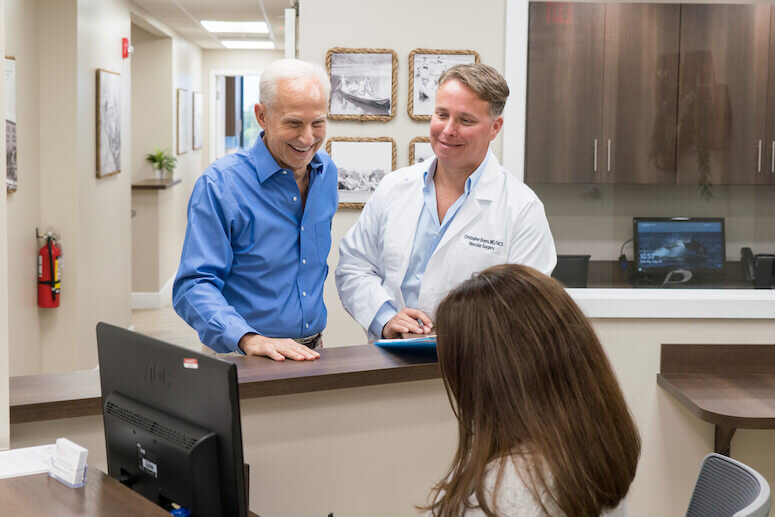 Dr. Christopher W. Boyes of Coastal Vein and Vascular Specialists with a Patient