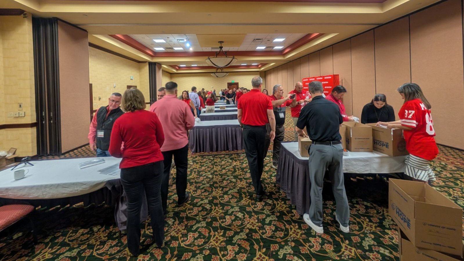 New Mexico State Farm Agents packing bags of personal hygiene products for Convoy of Hope. Call us today for a free auto quote!