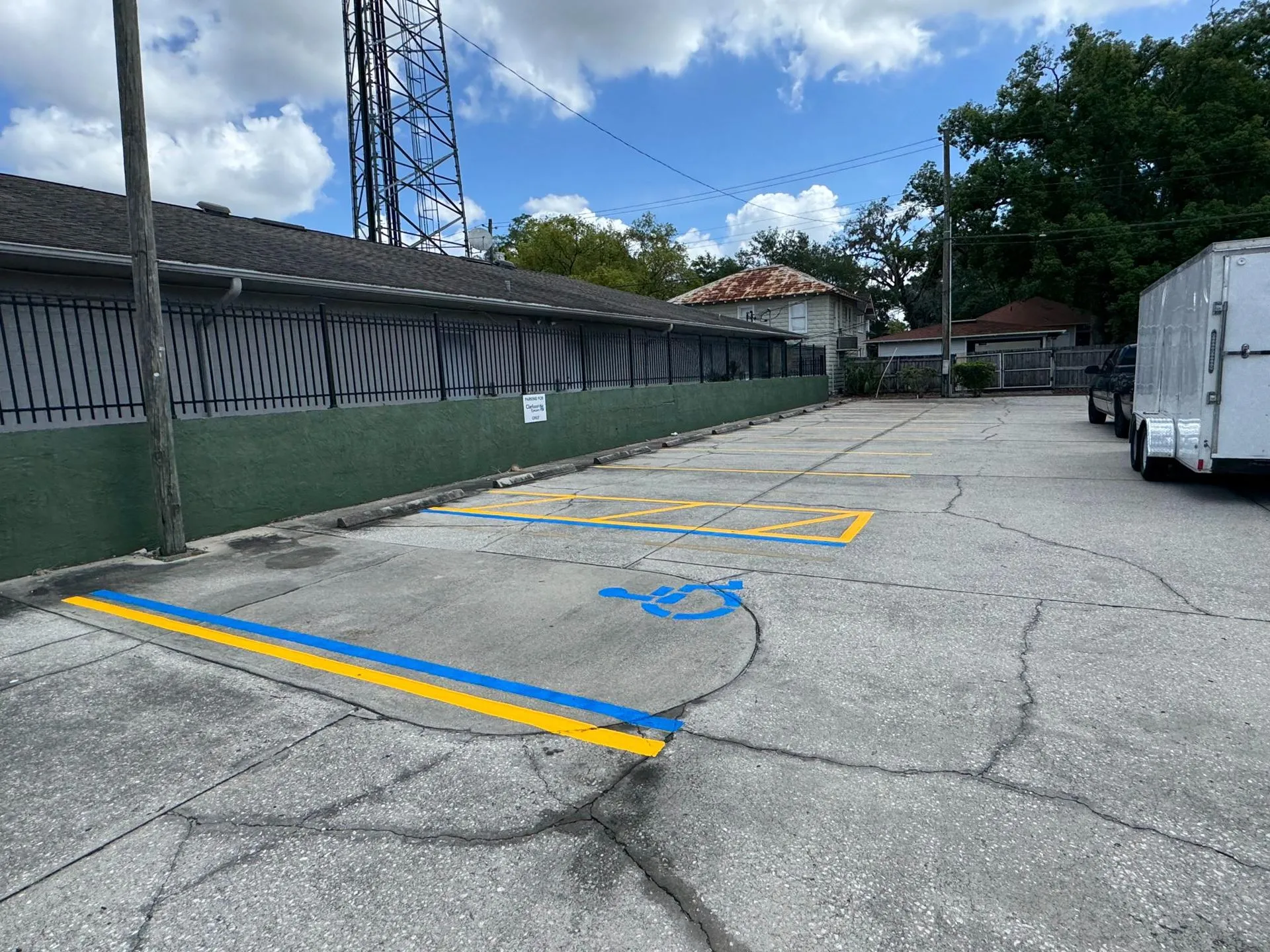 Commercial parking facility featuring newly applied yellow parking lines that improve visibility, organization, and customer parking experience.