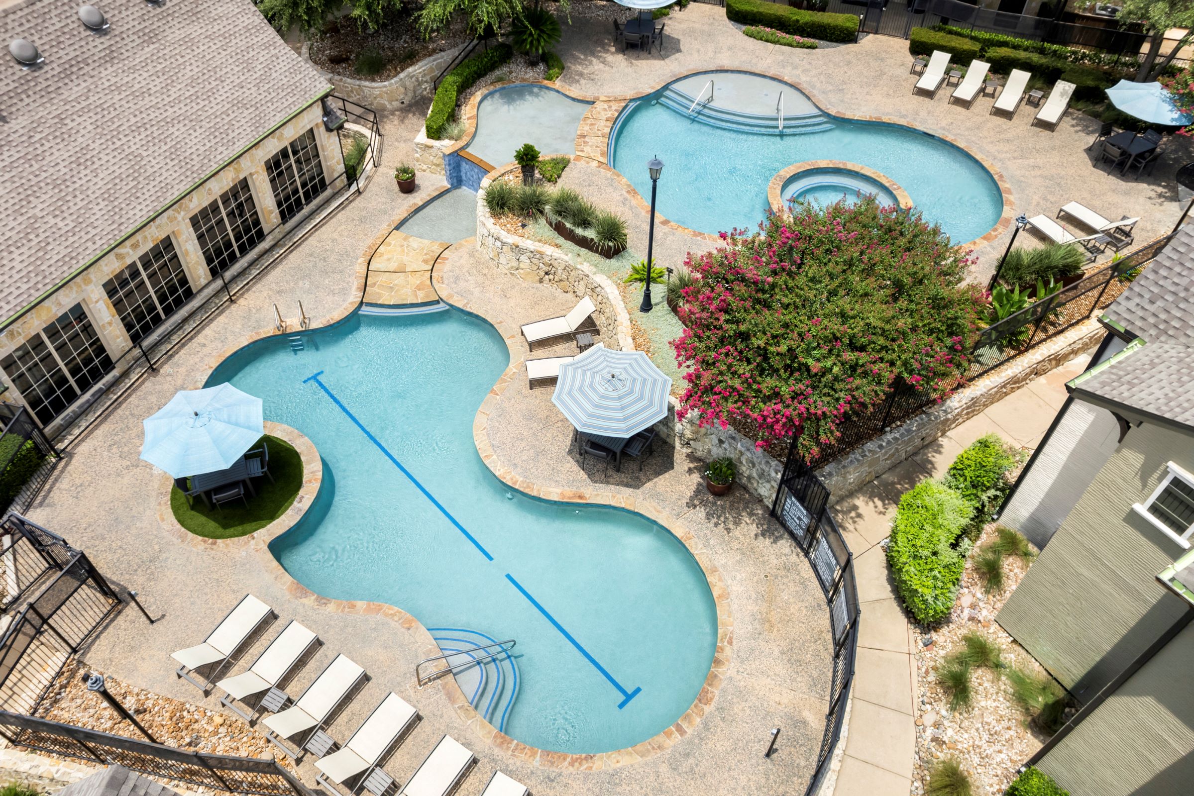 Aerial view of two-level pool at Camden Shadow Brook apartments in Austin, TX 