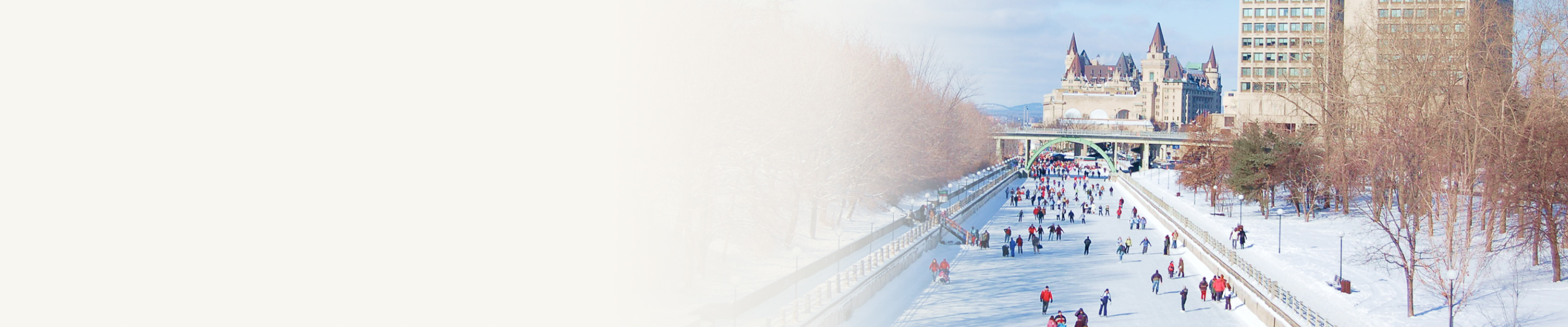 People skating on the frozen surface of the Rideau Canal in the winter.