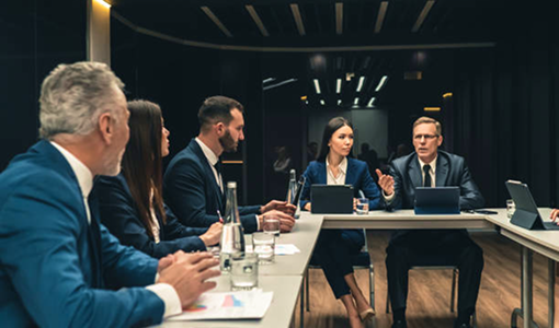 Wealth advisors collaborating in an office setting.