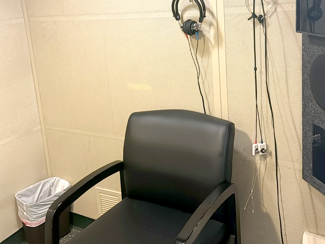 Interior photo of the hearing testing booth in the AudioNova hearing clinic in Fort Wayne, IN