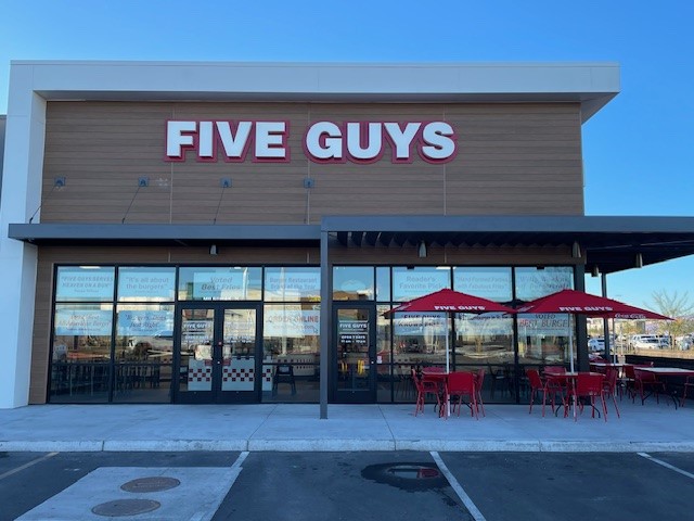 Exterior photograph of the Five Guys restaurant at 13544 North Prasada Parkway in Surprise, Arizona.