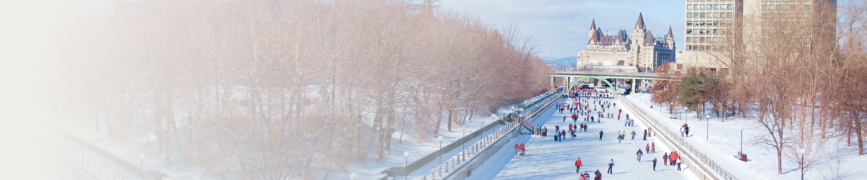 People skating on the frozen surface of the Rideau Canal in the winter.