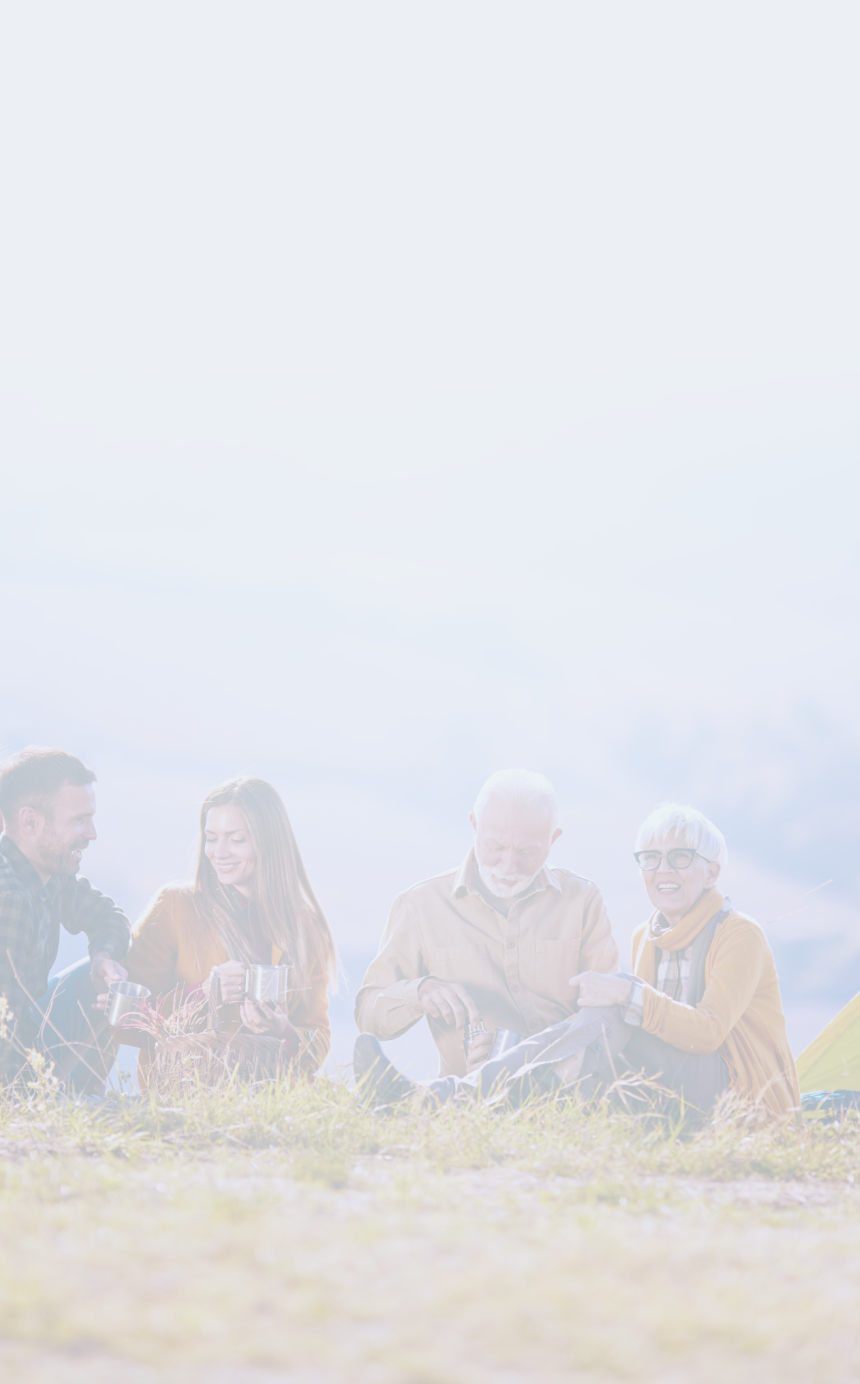 A multigenerational family camping in the mountains.