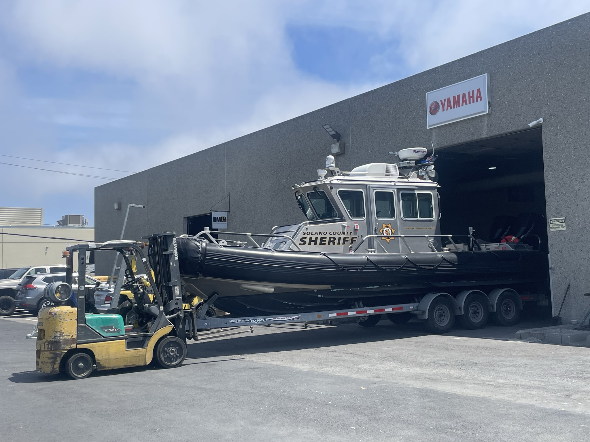 Sheriff's boat arriving for outboard repower.