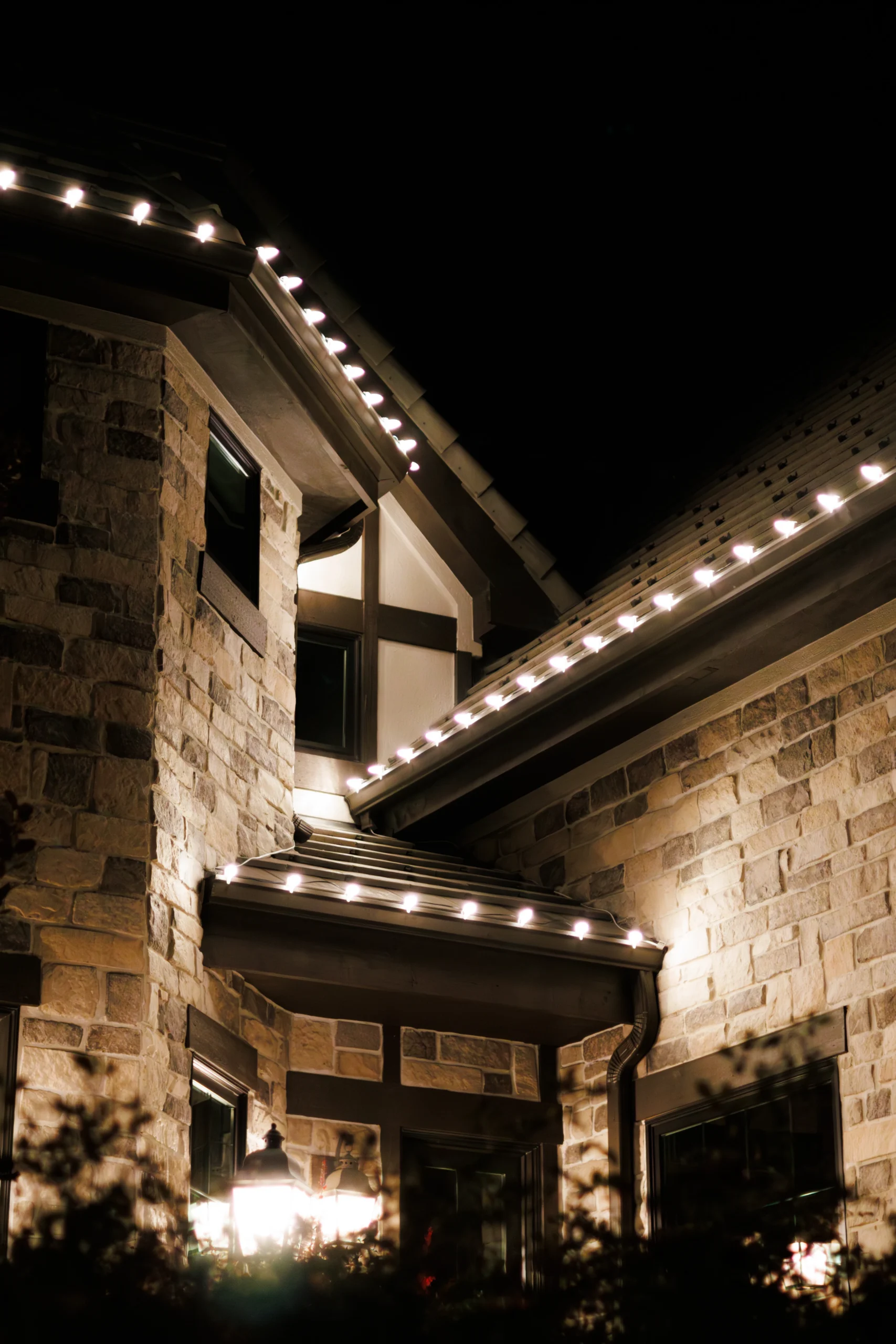 C9 bulbs at close range. Even spacing along every eave and rake is what separates a professional run 