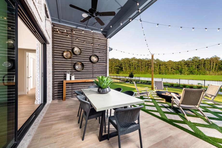 The Adam's covered patio extends from the great room Lakes at Creekside - Villa Collection Tomball (346)271-7799