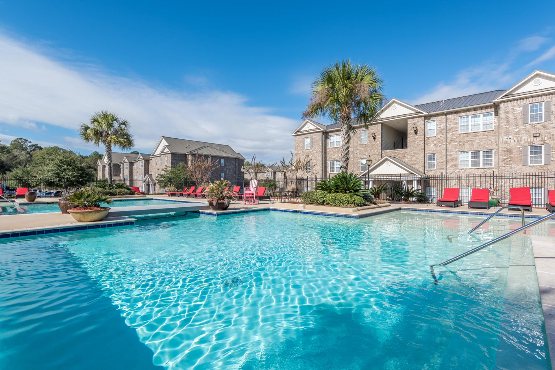 Relax at our large outdoor pool area Central House on Stadium Apartments Mobile (251)272-4710