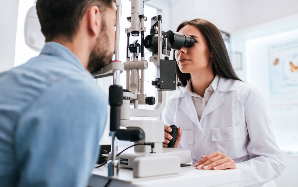 Female Optometrist giving an eye exam