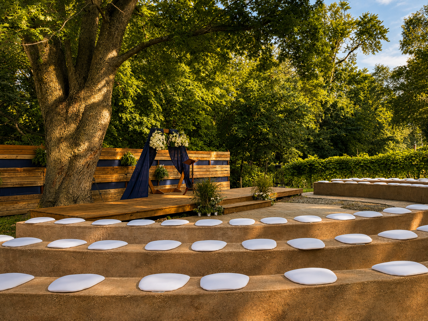 Amphitheater with podium and lovely plants on each side.
