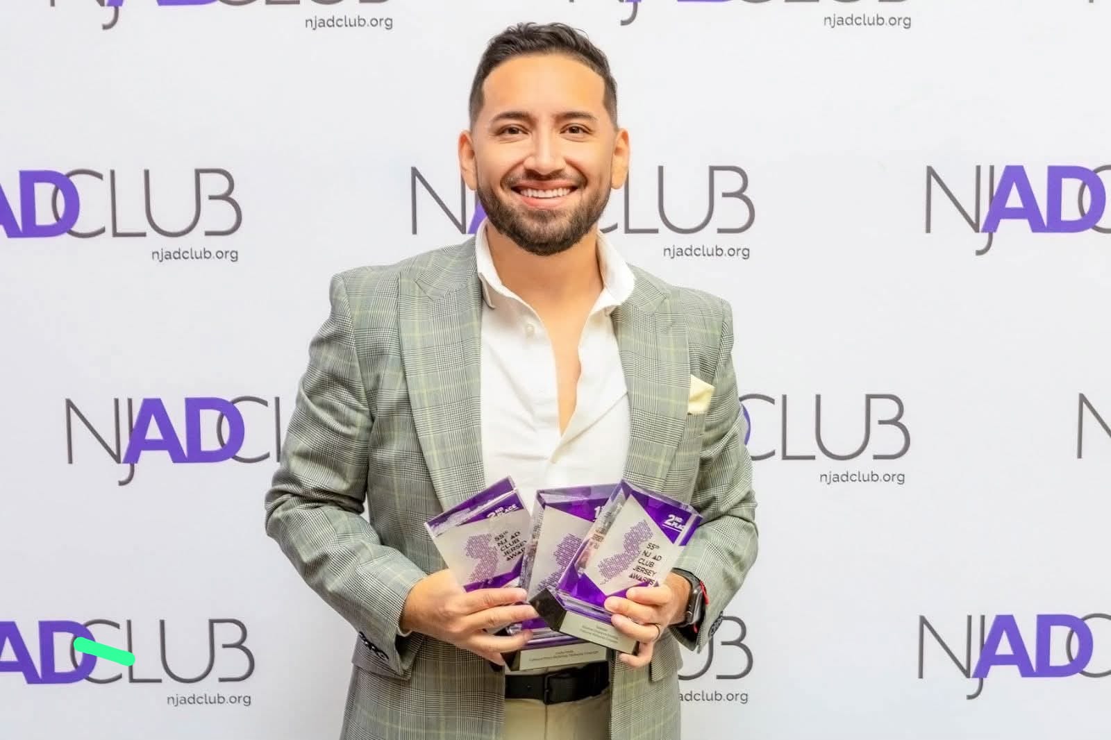 One Marketing Group team member receiving recognition at the NADILB event.