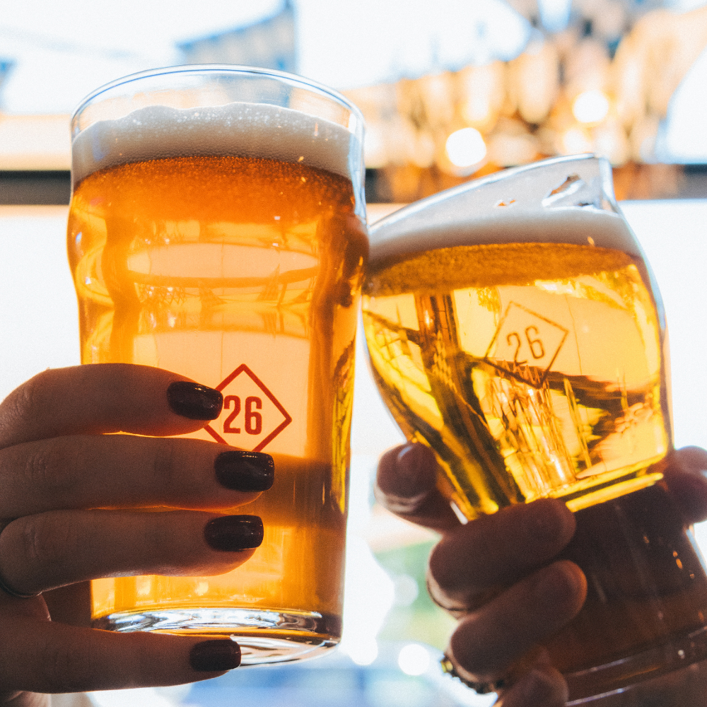 Friends raise their glasses to celebrate great beer and community at Station 26 Brewing Co. 