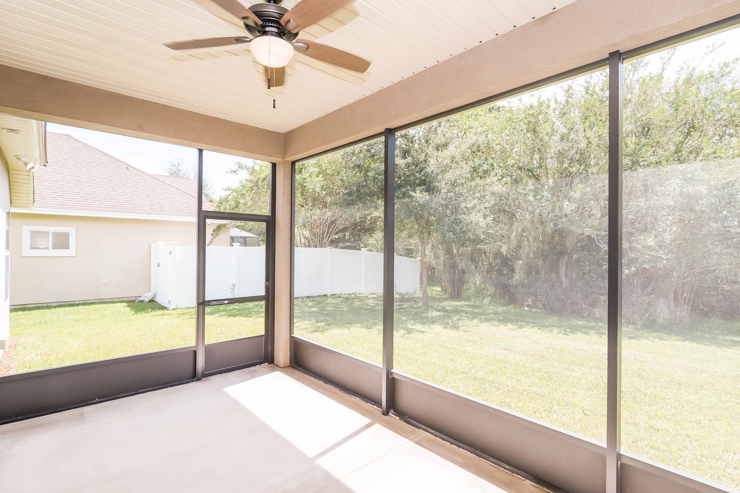 Screened-in patio with fan at Invitation Homes Jacksonville.