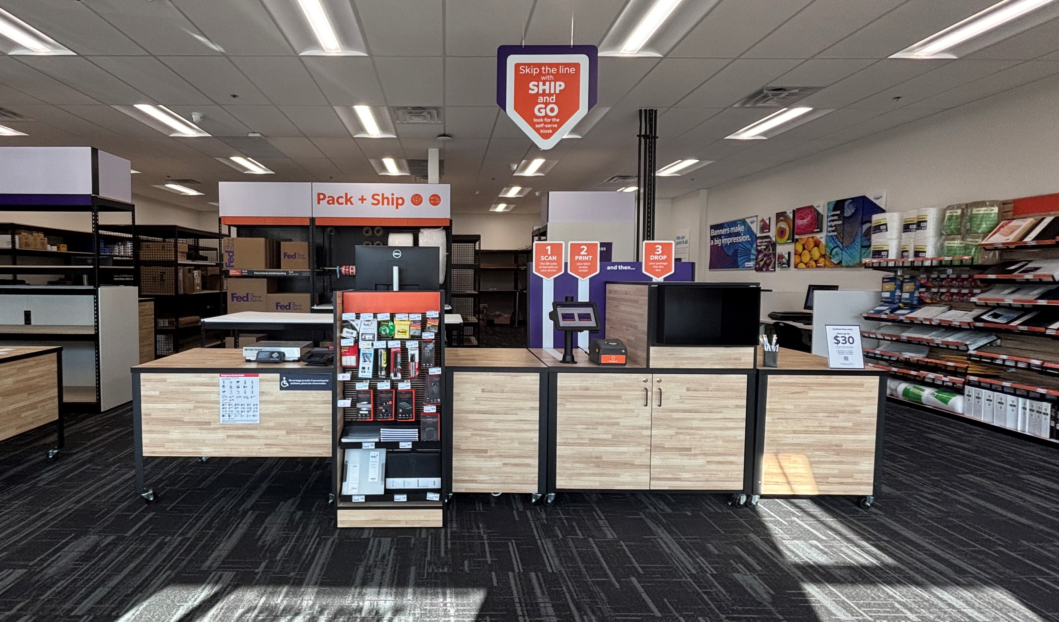 A clean view of the Pack + Ship counter and self-service Ship & Go kiosk at the FedEx Office in Temple, TX.