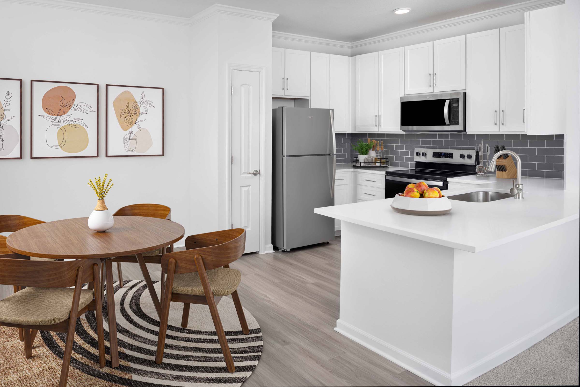 Kitchen and dining room at Camden Montague apartments in Tampa, FL