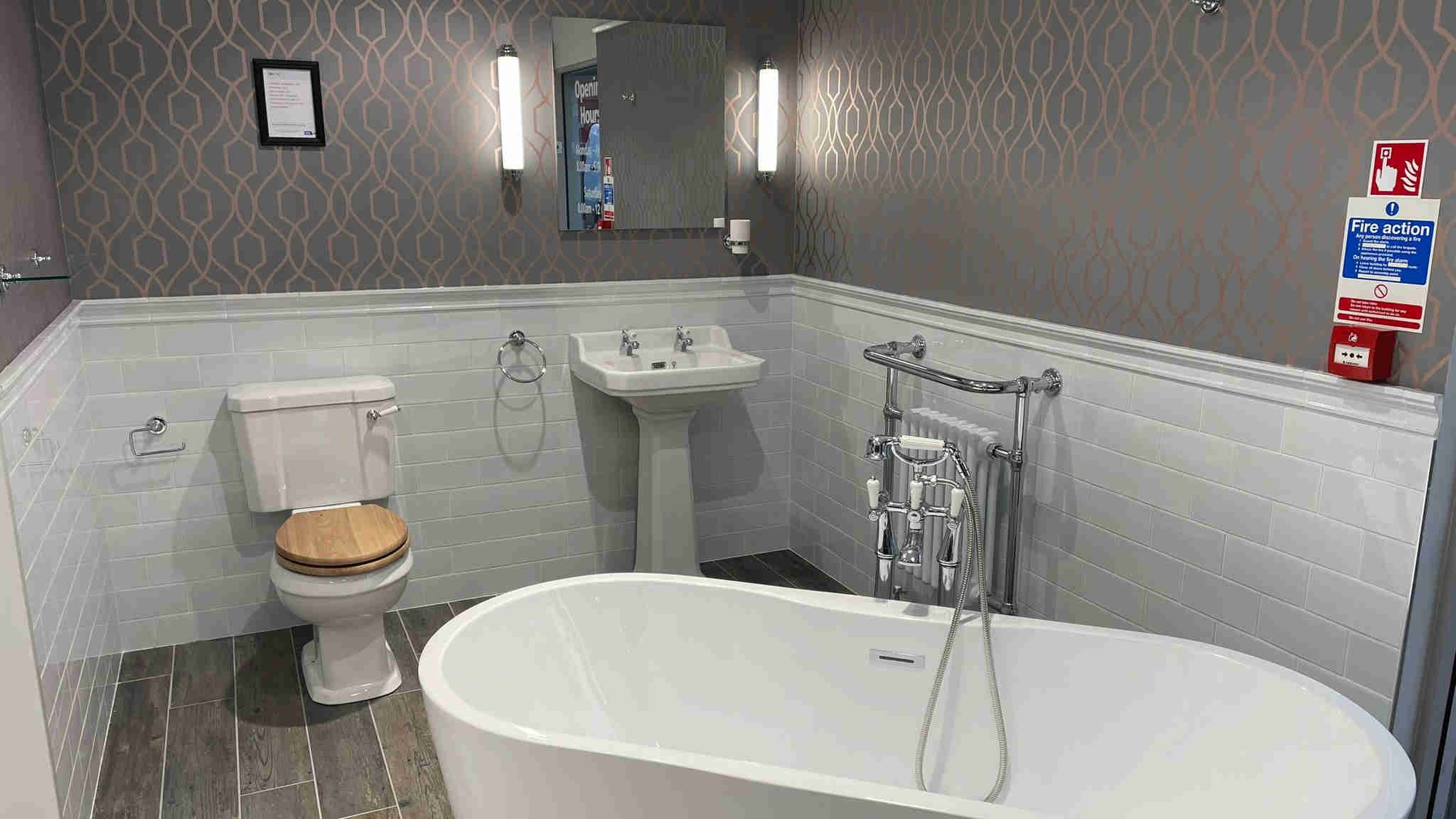 Nabis Traditional sanitaryware with free standing bath and chrome accents.