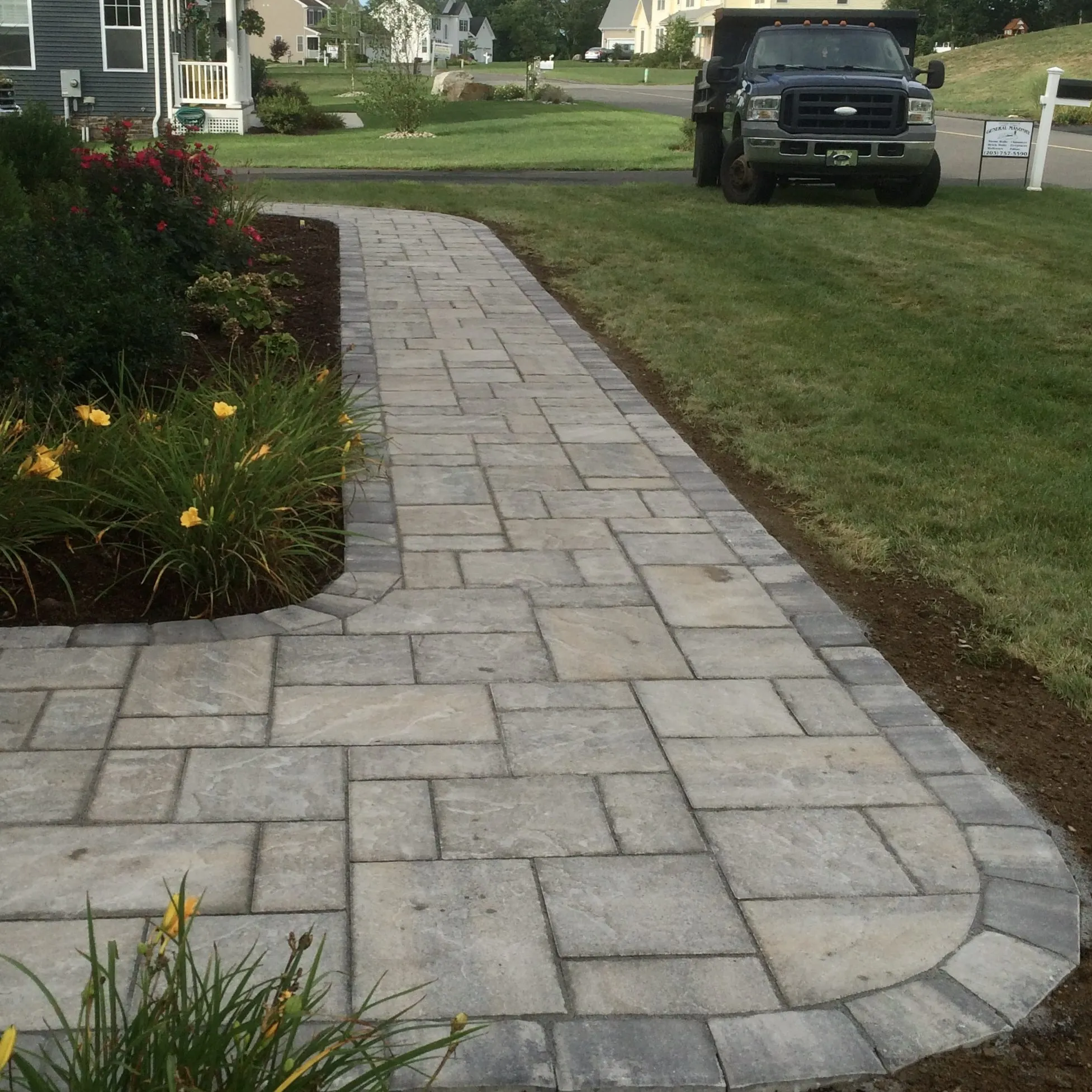Curved paver walkway - Walkways and pathways project by General Masonry LLC.