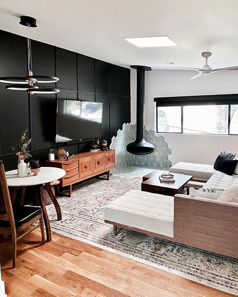The contrast of black roller shades against a white wall feels modern and chic. No matter the style, Budget Blinds of Rockwall, Forney, Terrell, and Greenville have you covered.