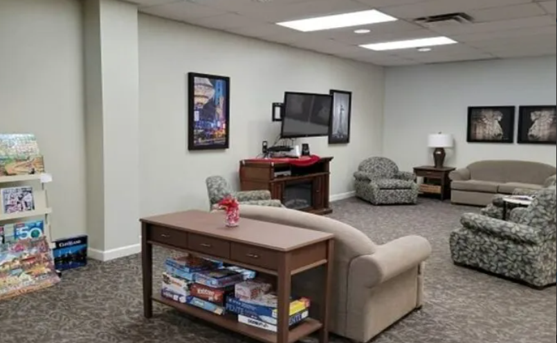 The spacious community room where residents may visit and enjoy daily activities.