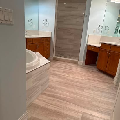 Completed bathroom remodel with a glass shower enclosure and updated vanity area. 