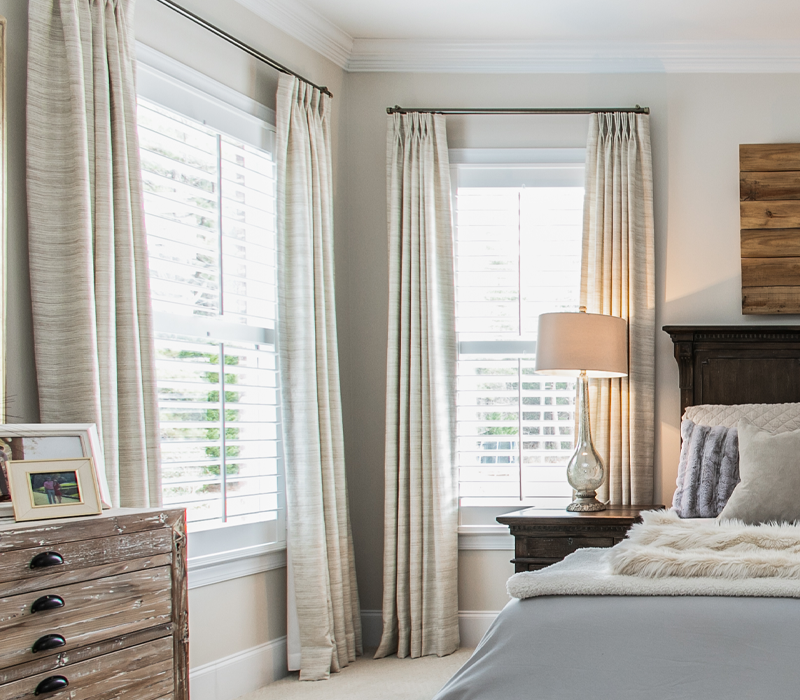 Pair elegant draperies with classic blinds.