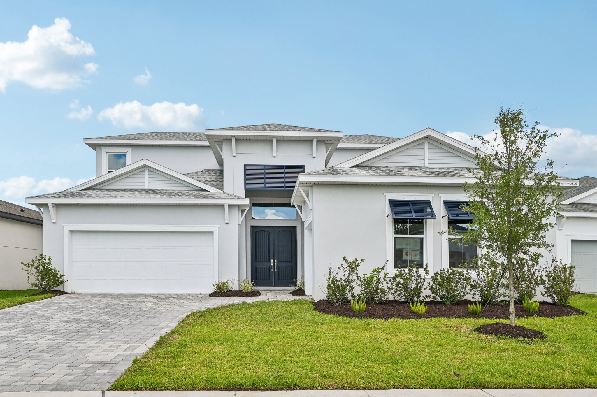 The Front Elevation of a DRB Homes Quick Move-In Home at Biscayne Landing at Seaire in Parrish, FL.