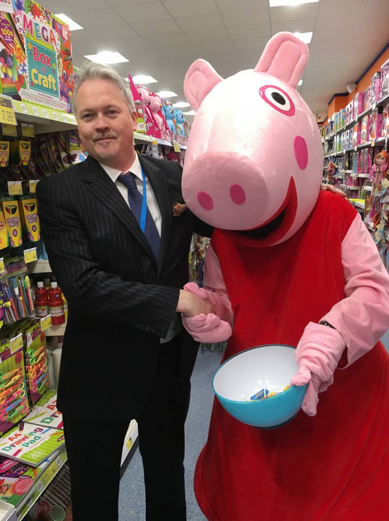 Peppa Pig poses at the opening of the new B&M Bicester store.