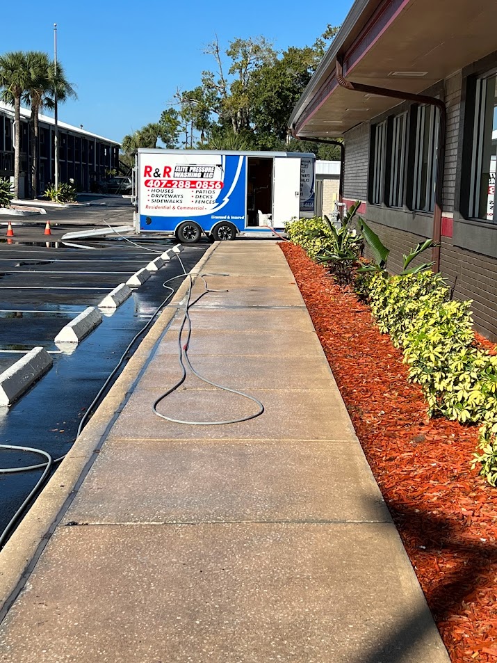 Professional commercial pressure washing in Davenport, FL, removing dirt, algae, mildew, and buildup from exterior surfaces.