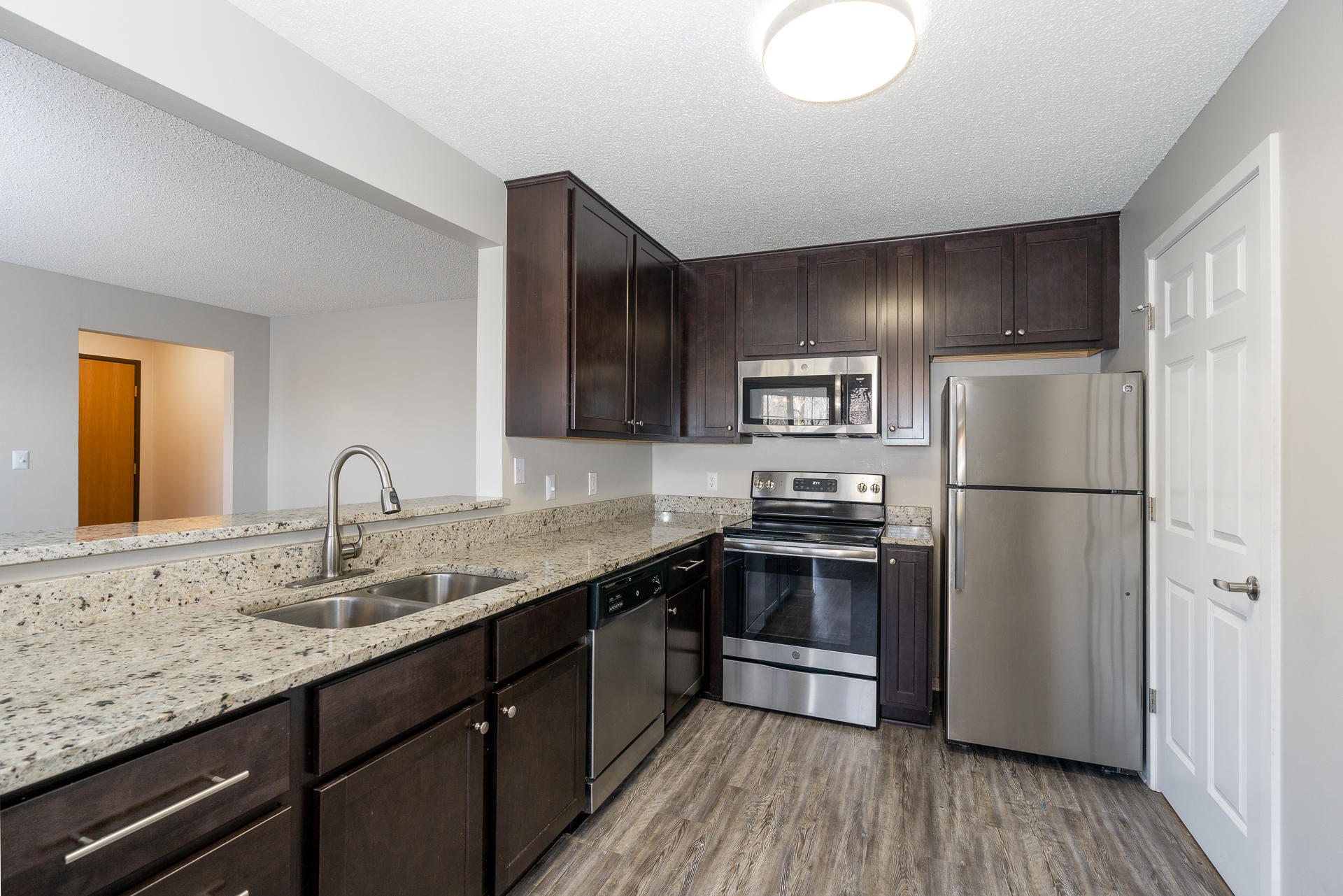 Fully-Equipped Kitchen With Stainless Steel Appliances & Granite Countertops