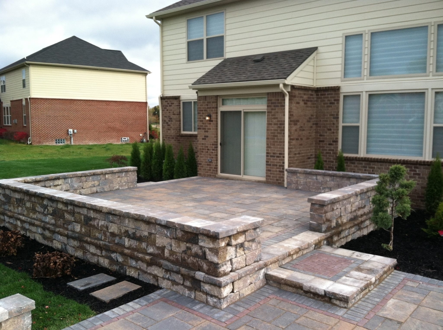 House with hardscaping built by M & D Design & Build