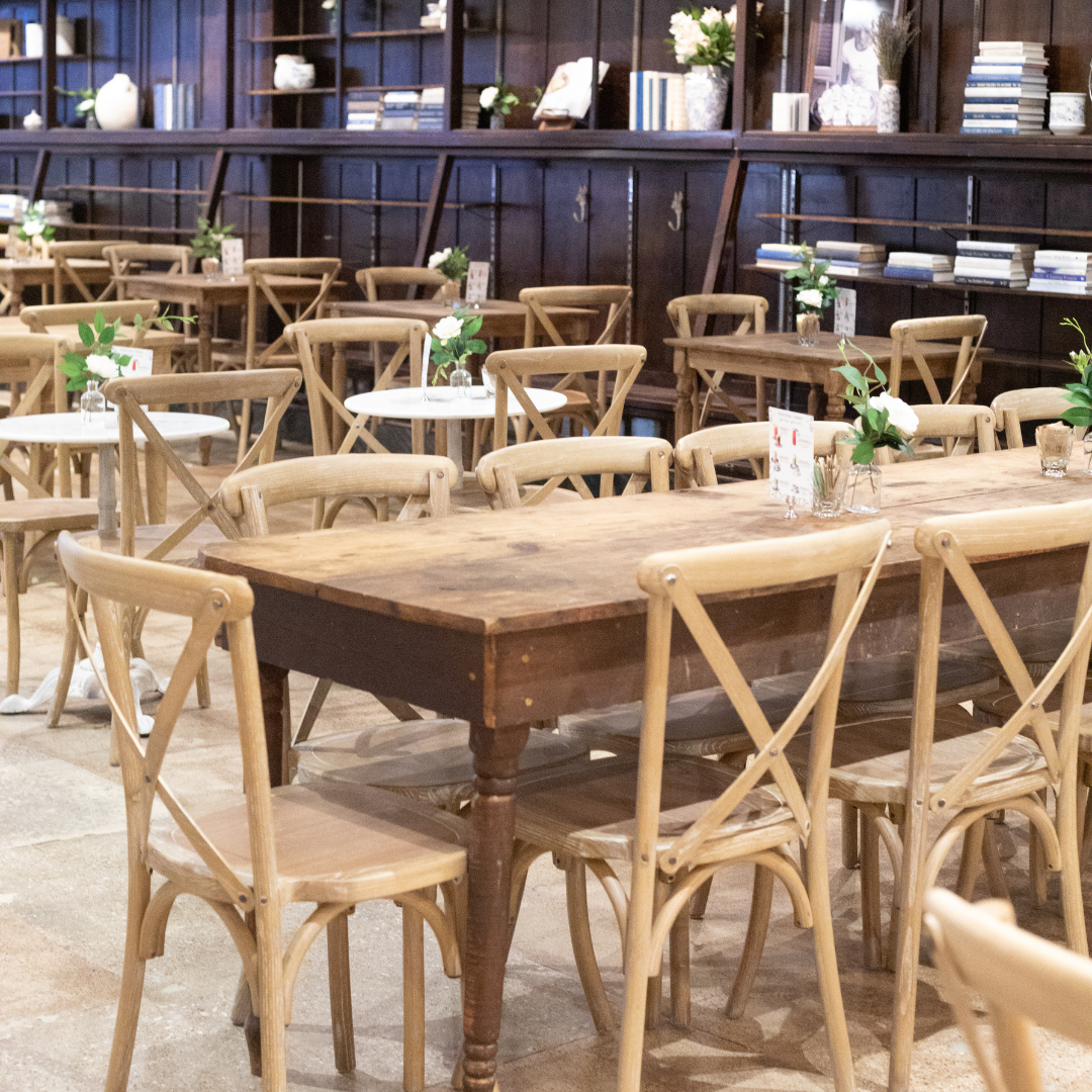 The image depicts a cozy dining space filled with wooden furniture. In the foreground, a large recta 