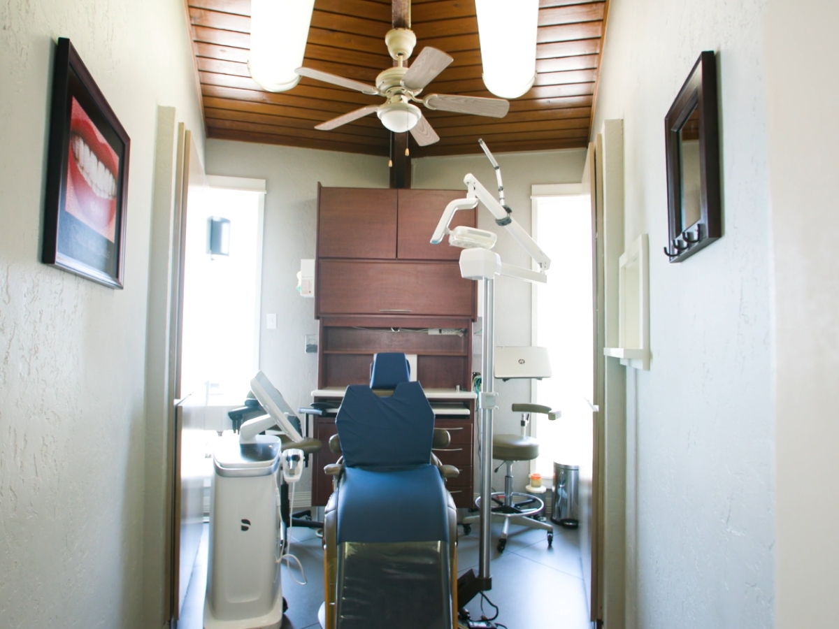 Clean, modern and welcoming treatment rooms equipped with technology and patient amenities (warm bla 