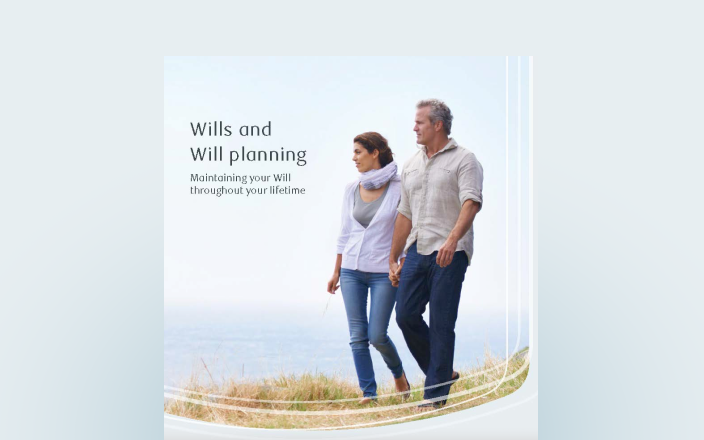 Cover of the Will planning guide featuring a couple walking hand in hand by a lake.