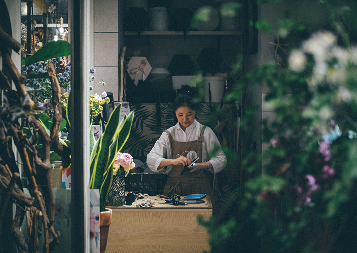 A florist working in her shop.