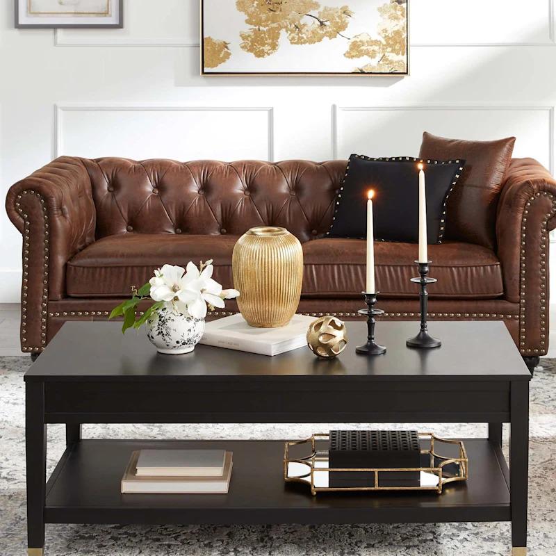A luxurious Chesterfield-style brown faux leather tufted sofa from the Providence collection, exudin At Home San Jose (408)454-4784