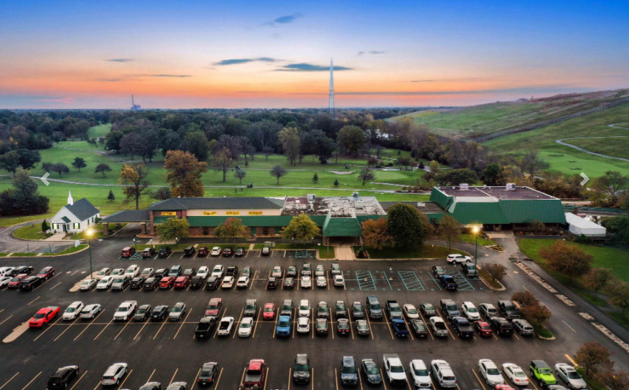 Ariel view of commercial building and parking lot for a banquet hall for sale by Farbman Group