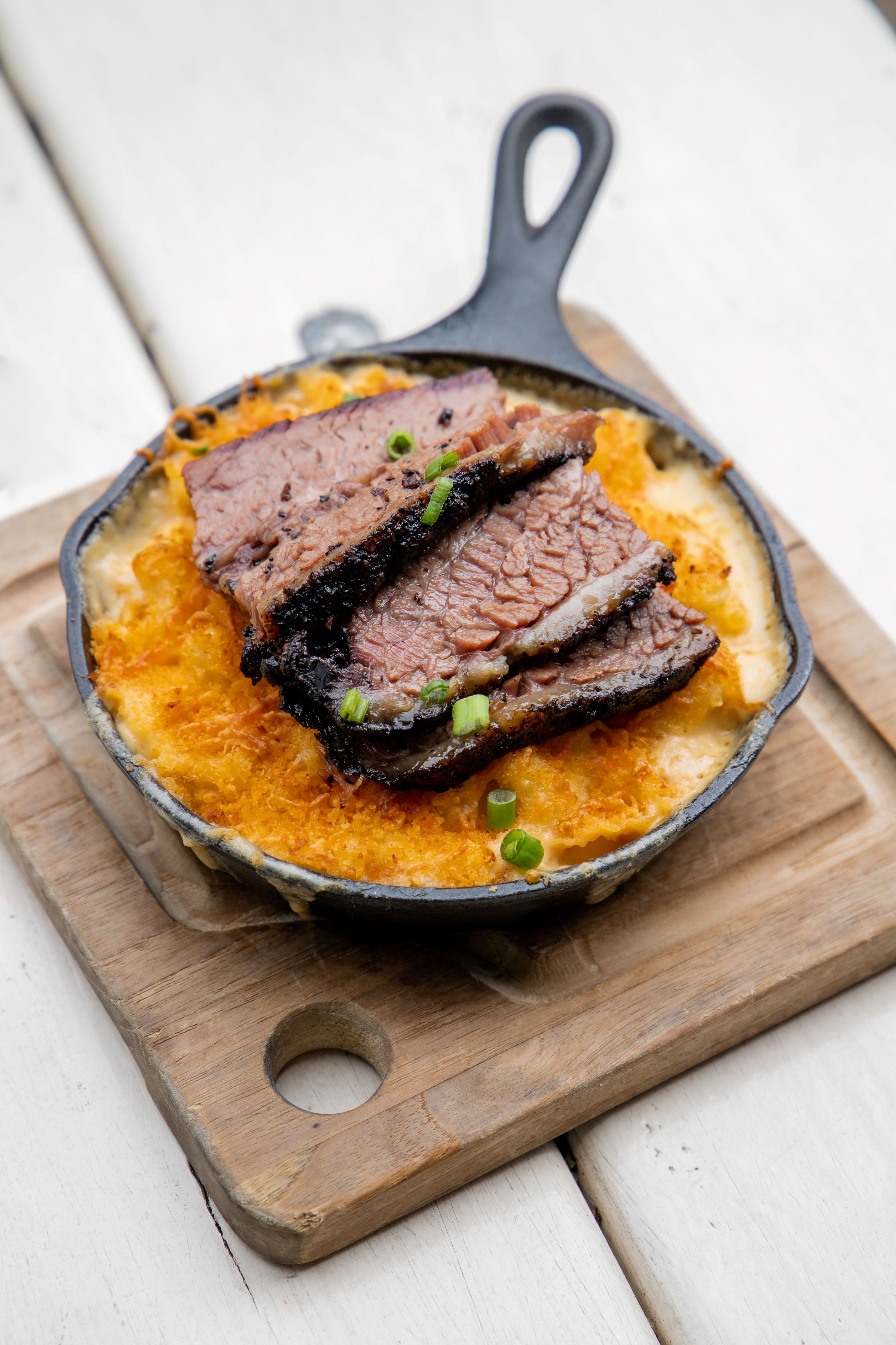 Del's Hideout housemade Mac and Cheese topped with fresh brisket. 