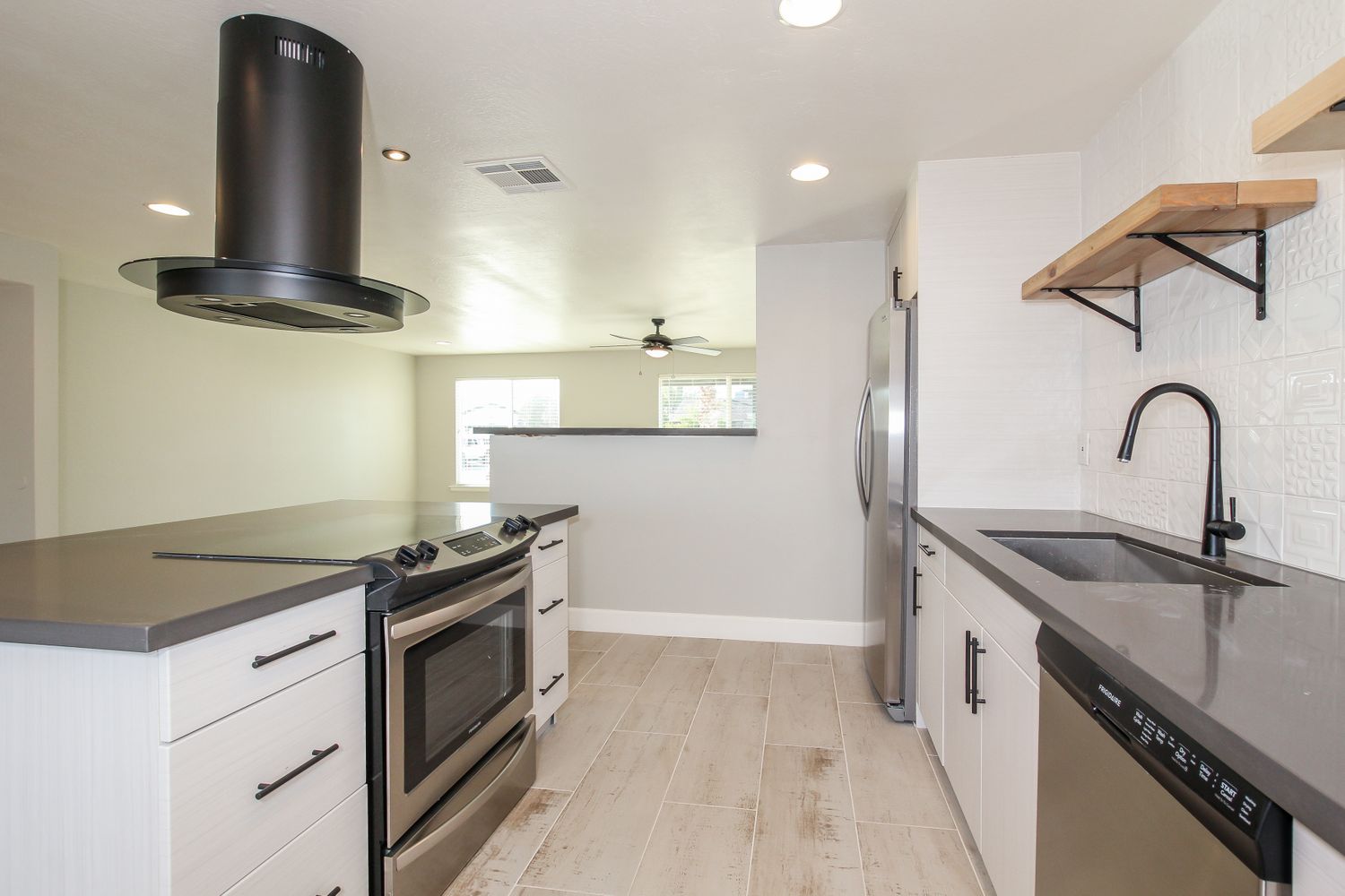 Modern kitchen with stainless steel appliances at Invitation Homes Phoenix.