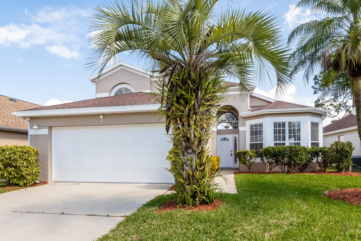 Charming home with a two-car garage at Invitation Homes Orlando.